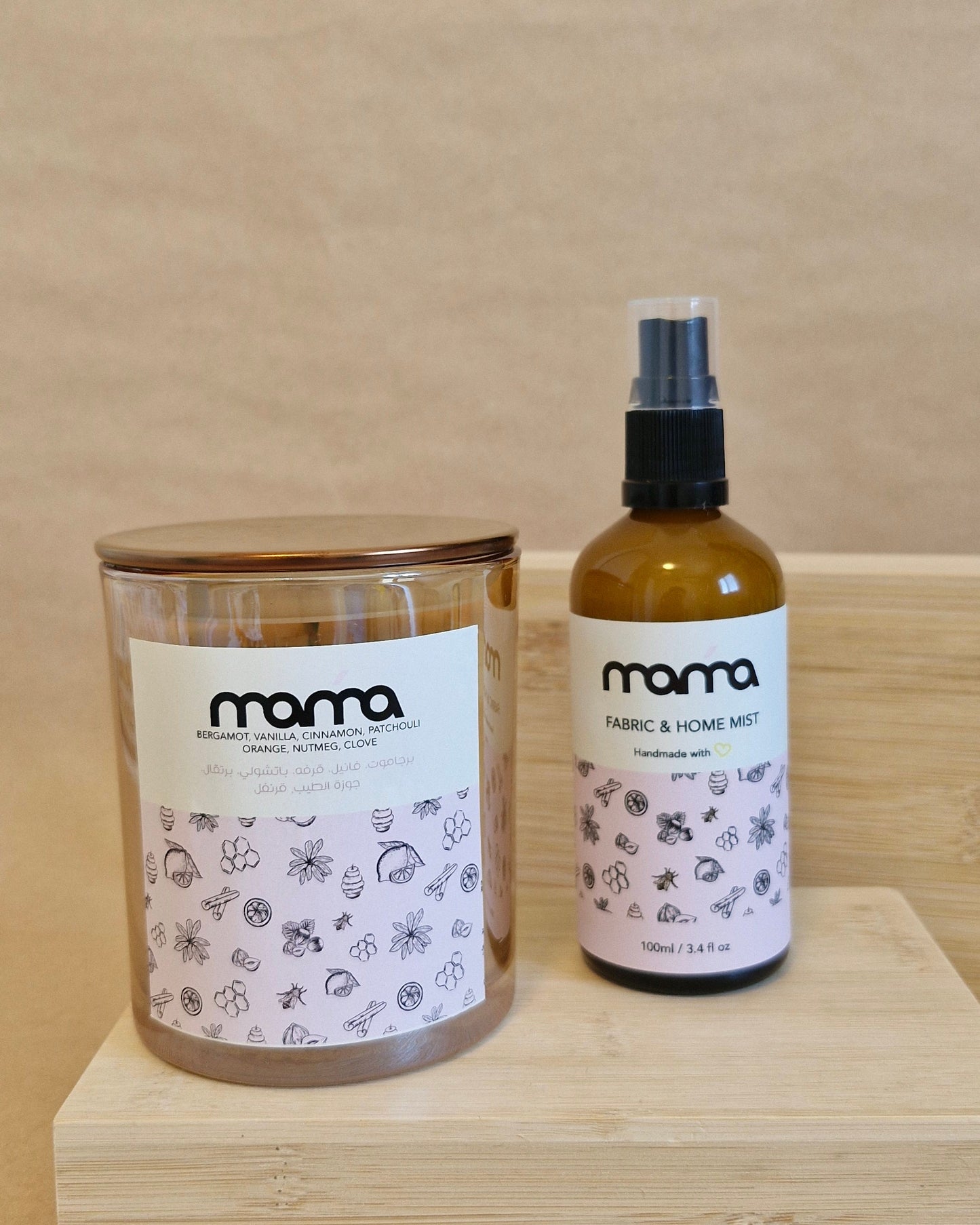 Two bottles of 'mama' products on a wooden surface