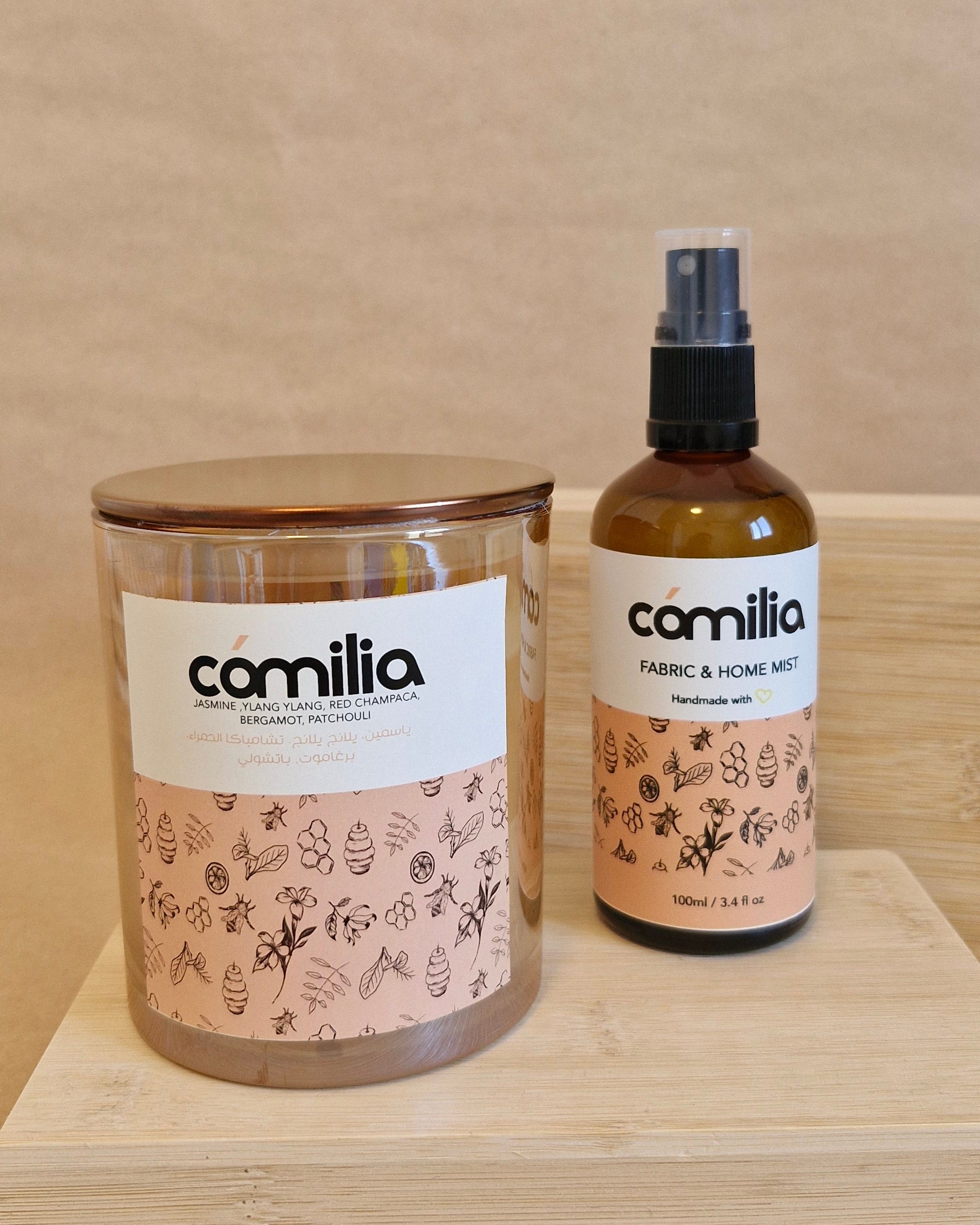 Two bottles of Camilla on a wooden surface